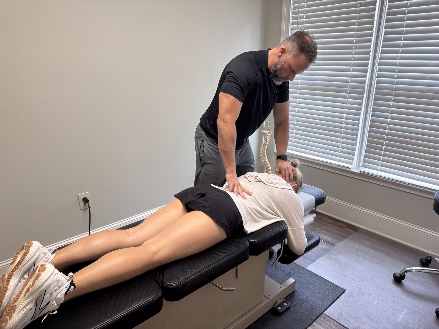 Dr. Joe Krzemien treating an athlete in the clinic